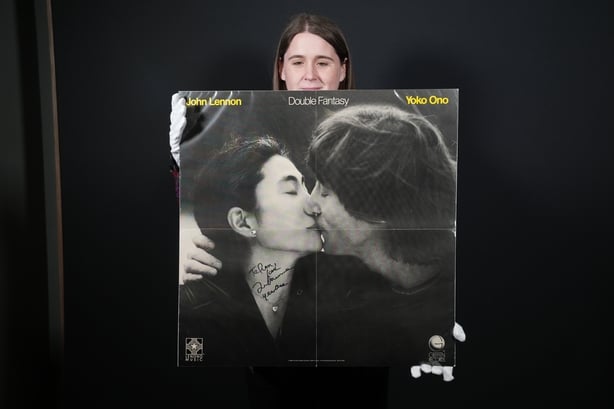 A promotional poster for John Lennon and Yoko Ono's Double Fantasy, signed by the former Beatles singer hours before his death aged 40 in 1980. Photo: Lucy North/PA Wire