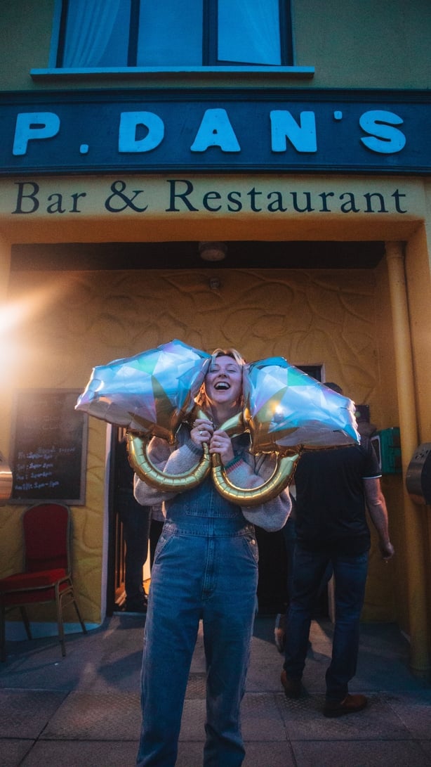 Eadaoin outside a pub