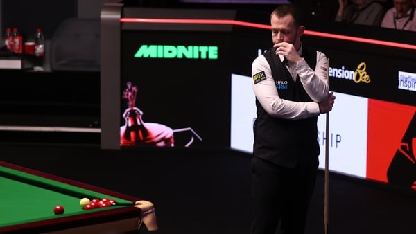 SHEFFIELD, ENGLAND - MAY 01: Mark Allen of Northern Ireland takes a look at the reds covering the black in the corner pocket with referee, Marcel Eckardt during the semi final match on day fourteen of the Halo World Snooker Championship at The Crucible Th