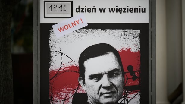 A sign counting the days journalist Andrzej Poczobut is in Belarusian captivity is seen in Warsaw, Poland on 28 April, 2026. The sign now has a sticker reading "free!" after Poczobut today was released 