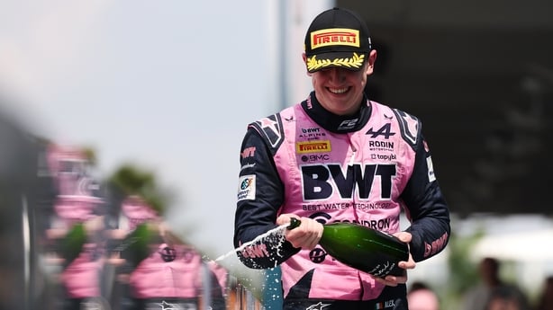 MIAMI, FLORIDA - MAY 02: Third placed Alexander Dunne of Ireland and Rodin Motorsport (15) celebrates with Champagne on the podium during the Round 2 Miami Sprint race of the Formula 2 Championship at Miami International Autodrome on May 02, 2026 in Miami, Florida. (Photo by Dom Gibbons - Formula 1/