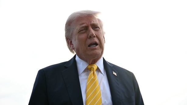 US President Donald Trump speaks with reporters