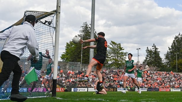 25 April 2026; Jason Duffy of Armagh scores his side's first goal despite the efforts of Oisin Smyth of Fermanagh during the Ulster GAA Football Senior Championship quarter-final match between Fermanagh and Armagh at Brewster Park in Enniskillen, Fermanagh. Photo by Ramsey Cardy/Sportsfile