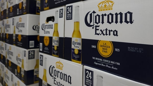 Cases of Corona Extra beer stacked in a warehouse