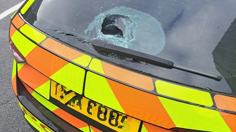 Photo shows the rear window of a PSNI vehicle which has been damaged