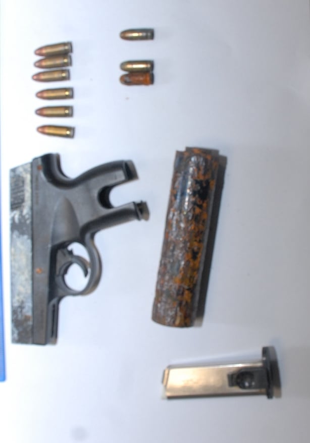 a photo of a gun and ammunition