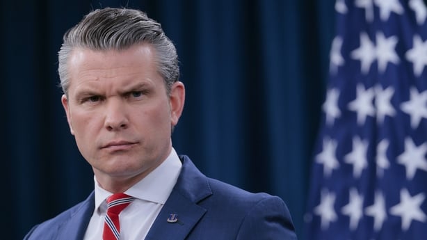 US Secretary of War Pete Hegseth looks on during a press briefing at the Pentagon 