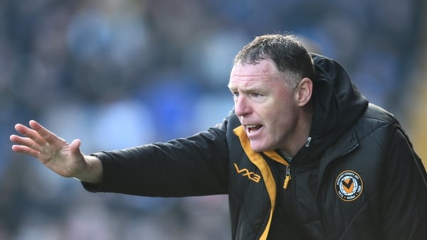 STOCKPORT, ENGLAND - MARCH 09: Newport County Manager Graham Coughlan gives his team instructions during the Sky Bet League Two match between Stockport County and Newport County at Edgeley Park on March 09, 2024 in Stockport, England. (Photo by Ben Robert