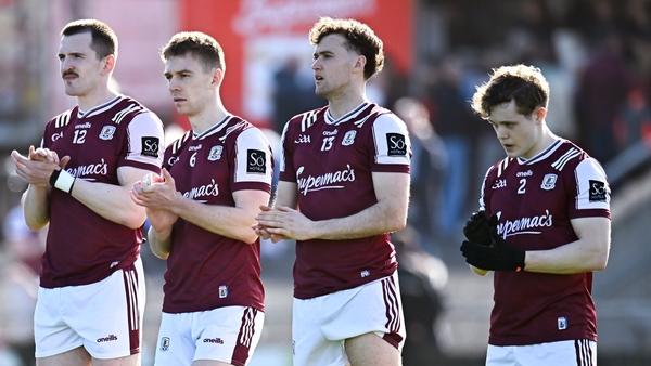 22 March 2026; Galway players, from left, Céin D'Arcy, Dylan McHugh, Robert Finnerty and Johnny McGrath applaud after a minute's silence for the late Michael Lyster, former RTÉ and Sunday Game broadcaster who died today, before the Allianz Football League