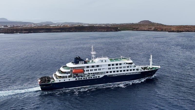 A drone view of the cruise ship MV Hondius, carrying passengers suspected of having cases of hantavirus on board, leaves Praia, Cape Verde