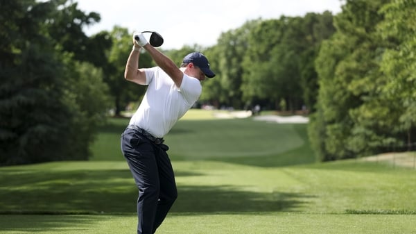 CHARLOTTE, NORTH CAROLINA - MAY 07: Rory McIlroy of Northern Ireland hits a tee shot on the third hole during the first round of the Truist Championship 2026 at Quail Hollow Country Club on May 07, 2026 in Charlotte, North Carolina. (Photo by Andrew Redin