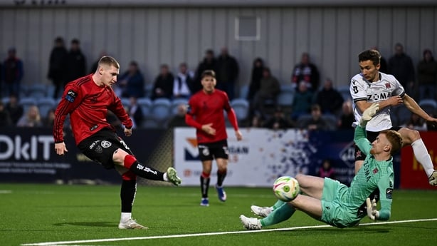 8 May 2026; Ross Tierney of Bohemians scores his side's first goal past Dundalk goalkeeper Enda Minogue during the SSE Airtricity Men's Premier Division match between Dundalk and Bohemians at Oriel Park in Dundalk, Louth. Photo by Ben McShane/Sportsfile