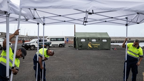 Workers set up tents at an expected reception point for passengers from the MV Hondius at the Granadilla Port In Tenerife.