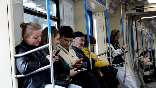 MOSCOW, RUSSIA - APRIL 4: Subway passengers look at their smartphones while riding in a train car., on April 4, 2026, in Moscow, Russia. Starting in the second half of March, Russian authorities sharply stepped up their fight against foreign messengers and resources, blocking internet access. (Photo