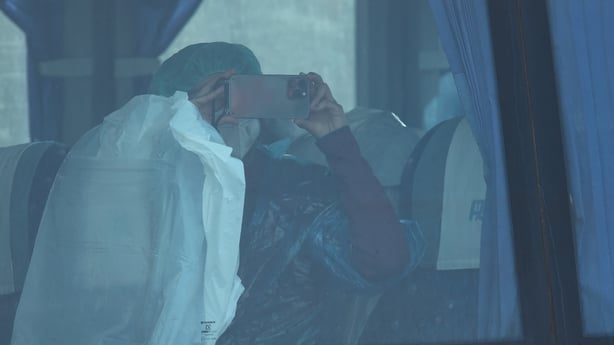 A passenger from the MV Hondius on a bus