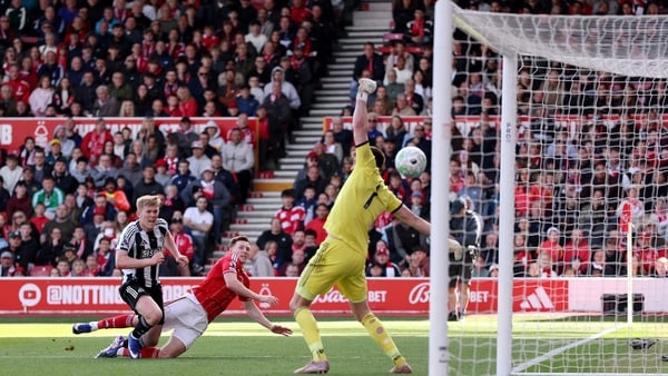 Elliot Anderson of Nottingham Forest scores his team's first goal while under pressure from Lewis Hall of Newcastle United during the Premier League match between Nottingham Forest and Newcastle United at City Ground on May 10, 2026 in Nottingham, England