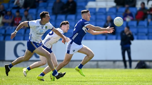 Patrick O'Sullivan of Laois in action against Padraig O'Toole, left, and Liam O'Neill of Wicklow during the Táilteann Cup round 1 match between Laois and Wicklow at Laois Hire O'Moore Park in Portlaoise, Laois.