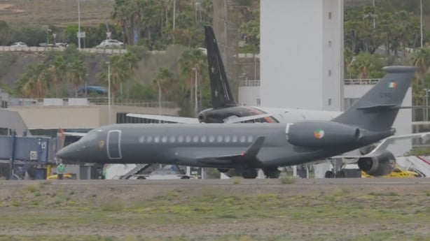 A grey plane owned by Ireland is pictured on a runway