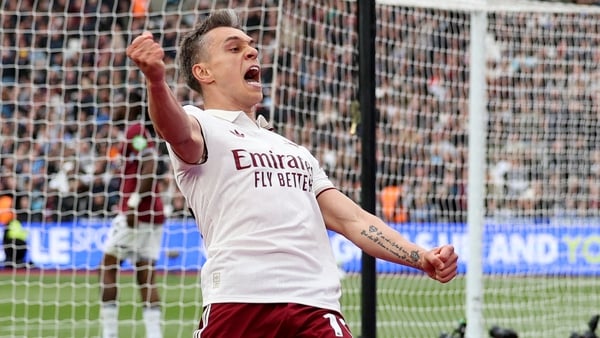 Arsenal's Belgian midfielder #19 Leandro Trossard celebrates scoring the team's first goal during the English Premier League football match between West Ham United and Arsenal at the London Stadium, in east London on May 10, 2026.