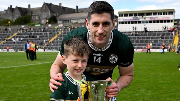 Kerry captain Paul Geaney and his son Páidí, with the Corn Pháidí Uí Shé, named in honour of legendary Kerry footballer Páidí Ó Sé, after the Munster GAA Football Senior Championship final match between Kerry and Cork at Fitzgerald Stadium in Killarney, K