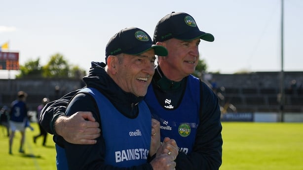 9 May 2026; Joint Offaly managers Mickey Harte, left, and Declan Kelly celebrate at the final whistle after the Táilteann Cup round 1 match between Clare and Offaly at Zimmer Biomet Páirc Chíosóg in Ennis, Clare. Photo by John Sheridan/Sportsfile