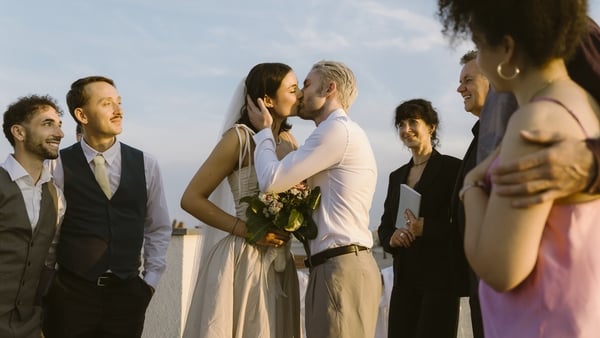 bride and groom kiss at wedding