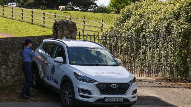 Gardai at the entrance to the scene in Rathfarnham where they commenced a search this afternoon in the investigation into the murder of Liam Murray in 2009