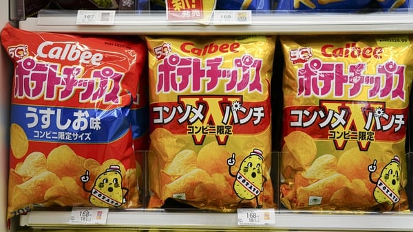 Bags of colourfully packaged crisps on a Japanese shop shelf