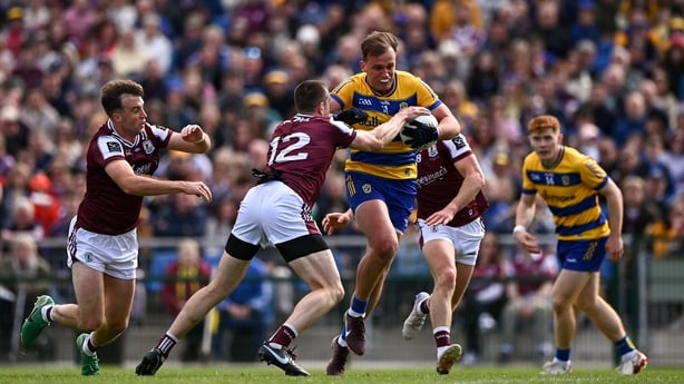10 May 2026; Enda Smith of Roscommon is tackled by Galway players, from left, Paul Conroy, Céin D'Arcy and Kieran Molloy during the Connacht GAA Football Senior Championship final match between Roscommon and Galway at King & Moffatt Dr Hyde Park in Roscommon. Photo by Ben McShane/Sportsfile