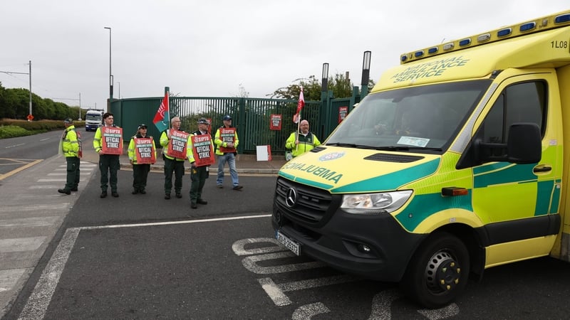 An ambulance leaves the National Ambulance Centre as striking members of the National Ambulance Service keep an emergency service available