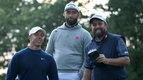 VIRGINIA WATER, ENGLAND - SEPTEMBER 11: Rory McIlroy of Northern Ireland, Jon Rahm of Spain and Shane Lowry of Ireland share a joke on day one of the BMW PGA Championship 2025 at Wentworth Golf Club on September 11, 2025 in Virginia Water, England. (Photo
