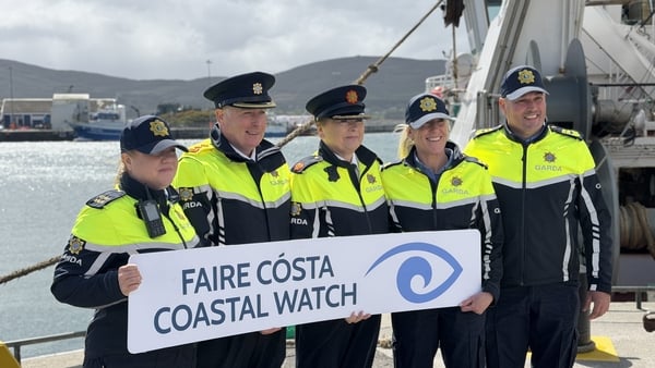 Gardaí hold Coatal Watch sign as they launch Coastal Watch scheme in Co Cork