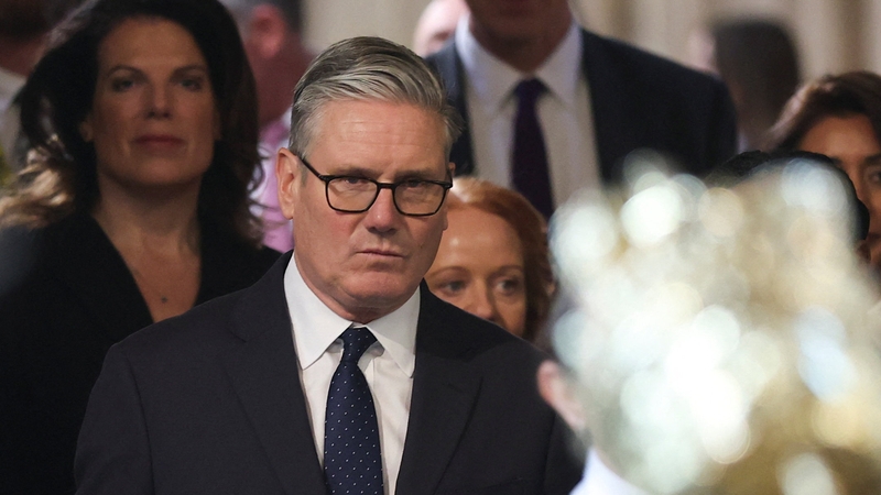 Keir Starmer walks through the House of Commons to attend the State Opening of Parliament