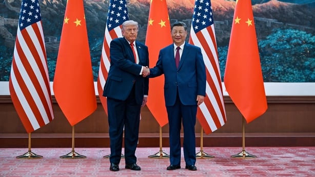 US President Donald Trump (L) shakes hands with China's President Xi Jinping at the Great Hall of the People in Beijing.
