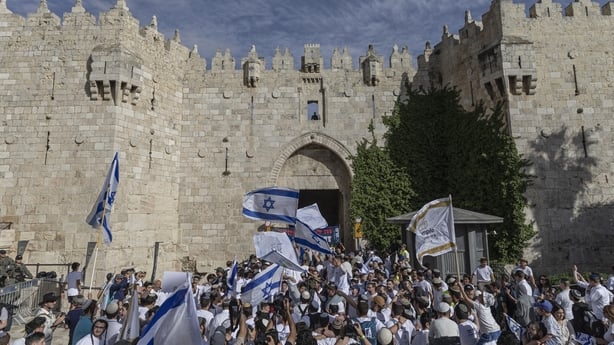 Israeli settlers take part in the Jerusalem Day parade at the Damascus Gate in the old city of Jerusalem 