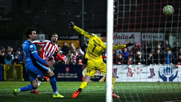 Michael Duffy of Derry City scores his side's second goal past Waterford goalkeeper Stephen McMullan during the SSE Airtricity Men's Premier Division match between Derry City and Waterford at The Ryan McBride Brandywell Stadium in Derry.