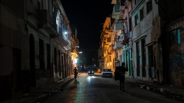People gather at bars and along the streets as nightlife continues during ongoing blackouts in Havana, Cuba
