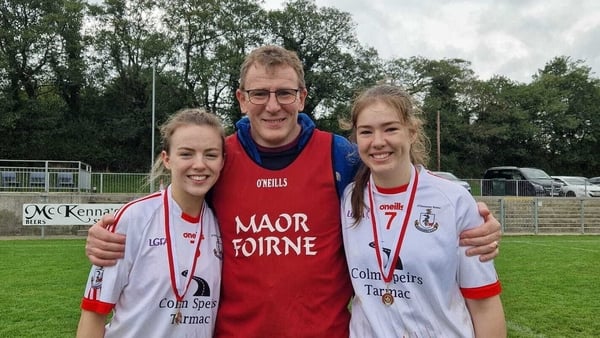 Leah Brewster (No.7) with her sister Grace and their father Paul after her club O'Donovan Rossa Magherafelt beat St Treas, Ballymaguigan in a Derry intermediate football championship final in 2024
