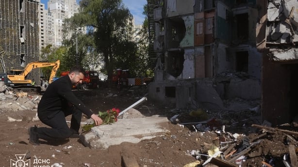 Volodymyr Zelensky pays tribute to the victims at the site of a nine-story residential building partially destroyed by a Russian missile strike in Kyiv, Ukraine on May 15, 2026