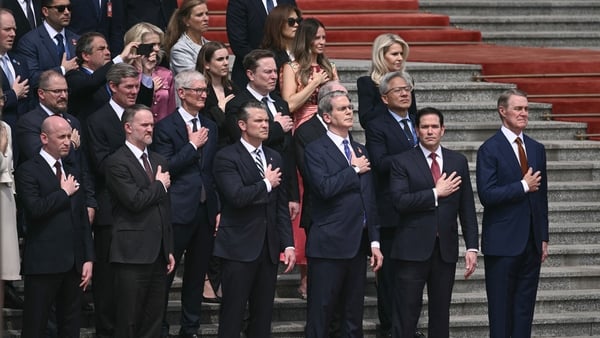 Group of politicans and company CEO stand on the steps of the Great Hall of the People in Beijing