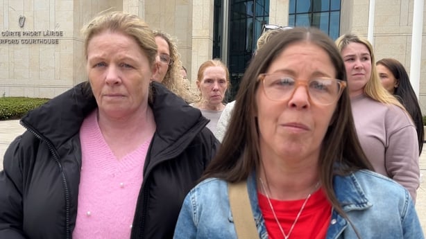 Deirdre O'Connor speaks to camera alongside a family member