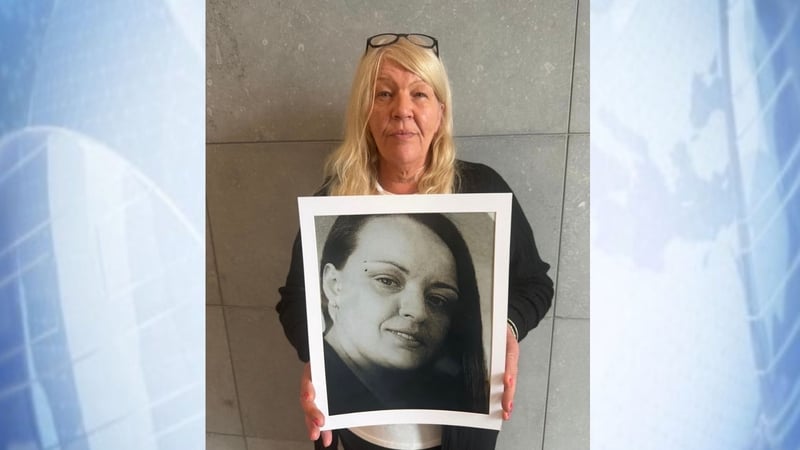 Catherine Crean holding a picture of her daughter Sharon