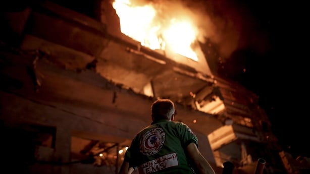 A fire breaks out at the apartment targeted by an Israeli attack at Rimal neigborhood in Gaza