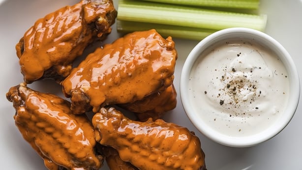 A photo of a plate of glazed chicken wings