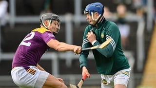 16 May 2026; Offaly goalkeeper Liam Hoare is tackled by Jack O'Connor of Wexford during the Leinster GAA Senior Hurling Championship Round 4 match between Offaly and Wexford at Glenisk O'Connor Park in Tullamore, Offaly. Photo by Tom Beary/Sportsfile