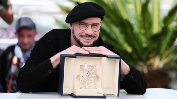John Travolta attends the Official Cannes Film Festival Photocall for Propeller One-Way Night Coach at the Palais des Festival on 16 May, 2026 in Cannes. (Photo by Andreas Rentz/Getty Images for Apple TV)