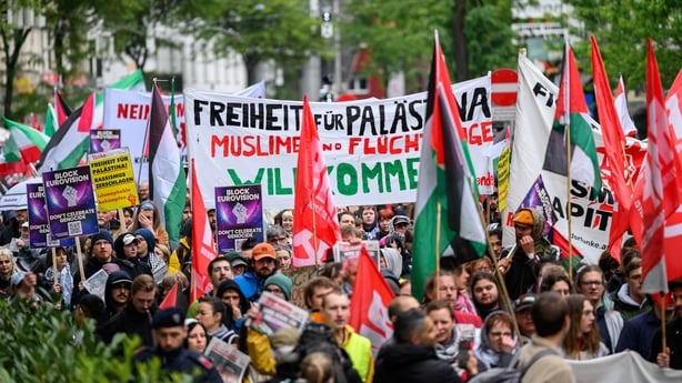 Participants waving Palestinian flags hold a placard reading Freedom for Palestine in a protest against Israel's participation in the Eurovision Song Contest, in Vienna on 16 May, 2026. (Photo by MAX SLOVENCIK/APA/AFP)