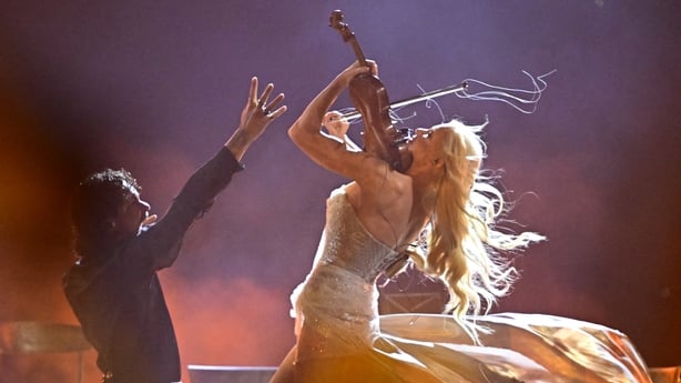 Finnish violinist Linda Lampenius and singer Pete Parkkonen, representing Finland with the song Liekinheitin, perform during the final of the Eurovision Song Contest at Wiener Stadthalle in Vienna on 16 May, 2026. (Photo by Tobias Schwarz/AFP)