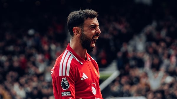 Bruno Fernandes of Manchester United celebrates Bryan Mbeumo scoring their third goal during the Premier League match between Manchester United and Nottingham Forest at Old Trafford on May 17, 2026 in Manchester, England.