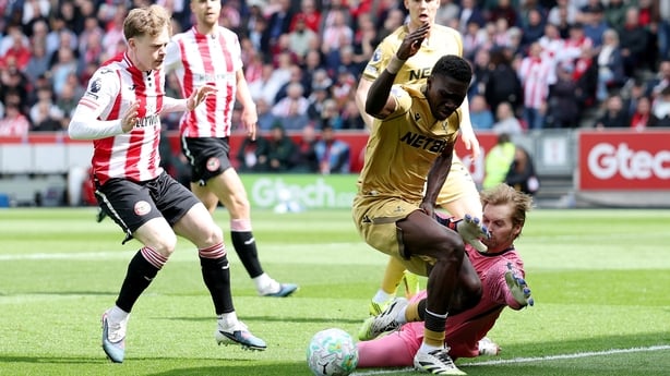 Caoimhin Kelleher of Brentford challenges Ismaila Sarr of Crystal Palace as Keane Lewis-Potter of Brentford looks on and after a VAR review a penalty is awarded during the Premier League match between Brentford and Crystal Palace at Gtech Community Stadium on May 17, 2026 in Brentford, England.